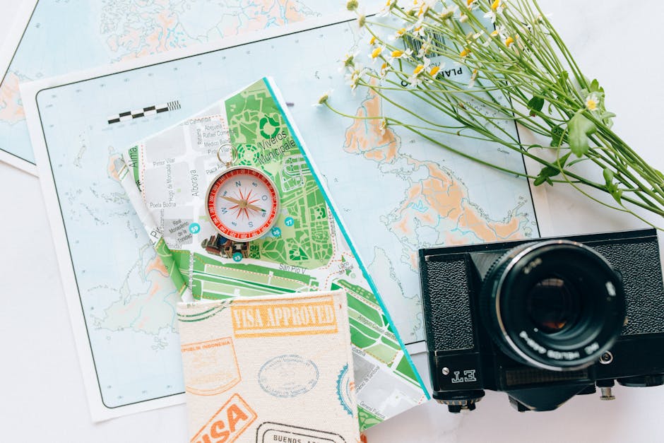 Wanderlust maps compass and vintage camera